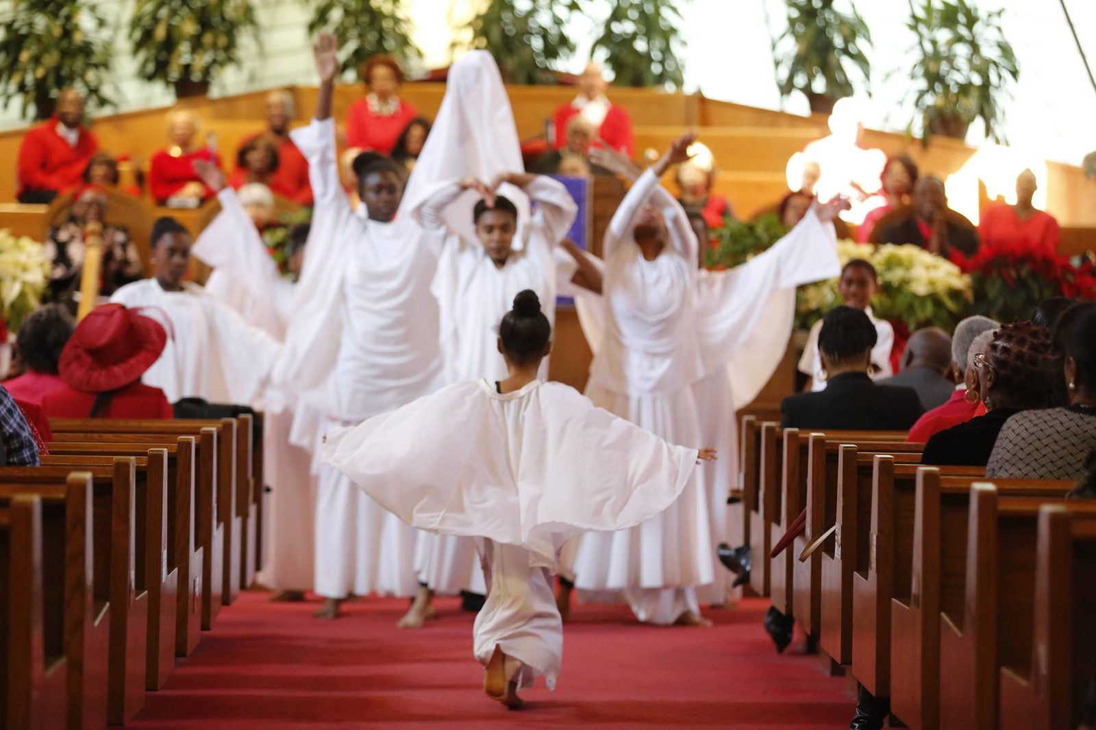 Saint Matthew liturgical dancers in white during worship